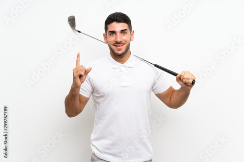 Handsome young golfer player man over isolated white background pointing up a great idea