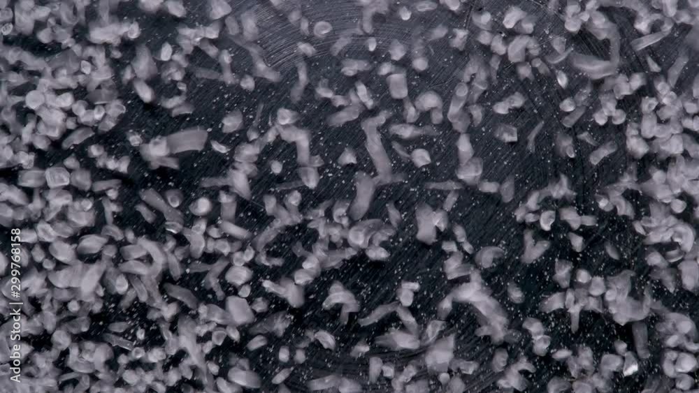 Sound waves move particles of salt, which randomly begin to move on the surface, scientifically called cymatics - physical effects of sound waves, close-up