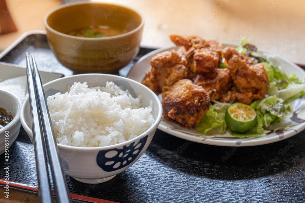 Japanese cuisine, fried chicken as known as Karaage served with Miso soup and Japanese rice Japanese cuisine, fried chicken as known as Karaage served with Miso soup and Japanese rice