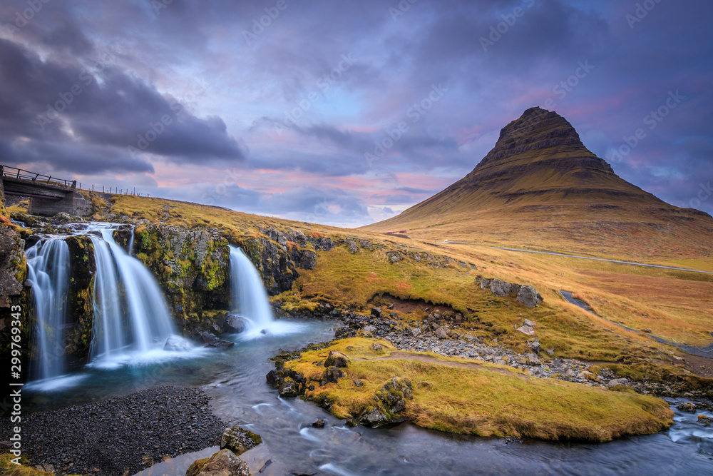 Incredible Nature landscape of Iceland. Fantastic picturesque sunset over Majestic Kirkjufell (Church mountain) and waterfalls. Kirkjufell mountain, Iceland. Famous travel locations.. Incredible Nature landscape of Iceland. Fantastic picturesque sunset over Majestic Kirkjufell (Church mountain) and waterfalls. Kirkjufell mountain, Iceland. Famous travel locations..