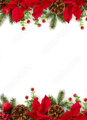 Christmas decoration. Frame of flowers of red poinsettia, branch christmas tree, ball, red berry on a white background with space for text. Top view, flat lay