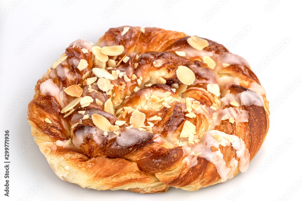 Close up of danish puff pastry with almonds isolated on white background.