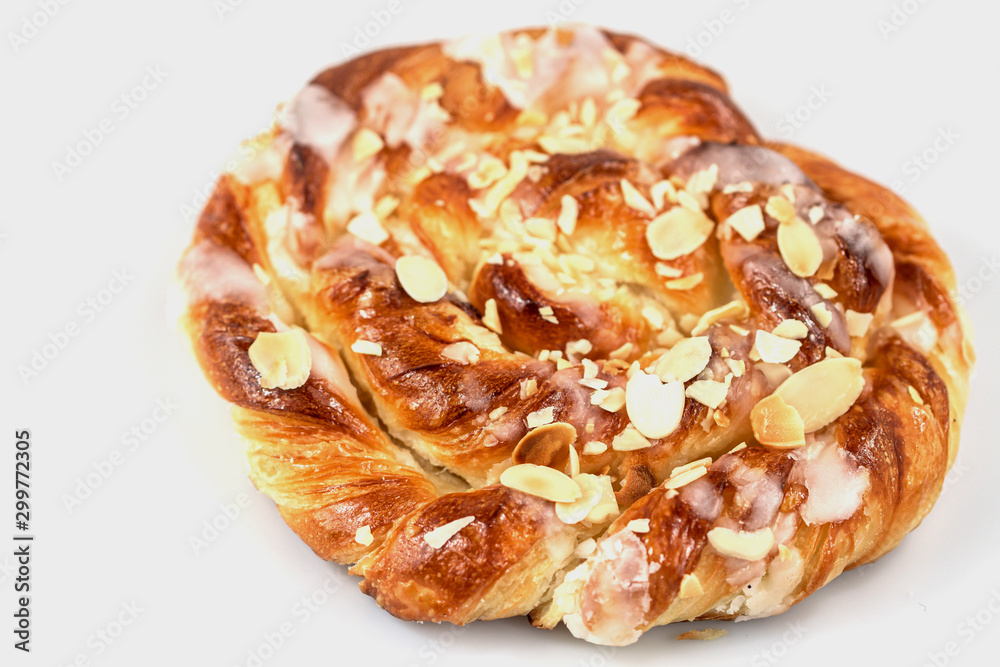 Close up of danish puff pastry with almonds isolated on white background. Close up of danish puff pastry with almonds isolated on white background.