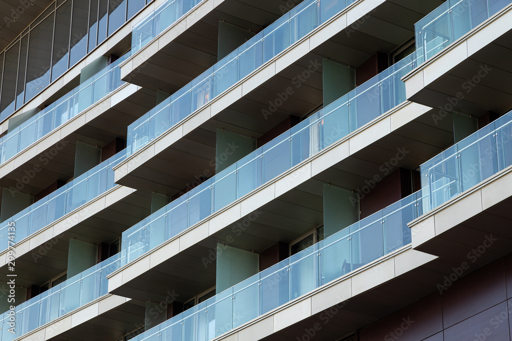 Close-up of glass balconies of modern hotel building Close-up of glass balconies of modern hotel building