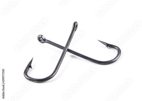 Two fishhooks lying crosswise one on top of the other, isolated on a white background with shadows. 100 percent sharpness. Macro.