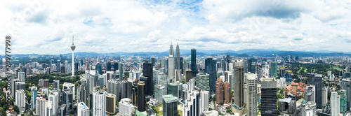 View from above, stunning panoramic view of the Kuala Lumpur skyline during a cloudy day. Kuala Lumpur commonly known as KL, is the national capital and largest city in Malaysia.