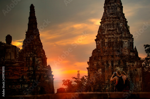 tourist taking a photo in wat chai wattanaram ayutthaya world heritage site of unesco thailand © stockphoto mania