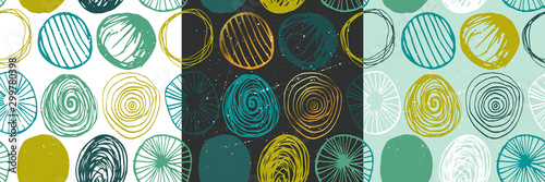 Beautiful vector set of three seamless grunge patterns in blue and green colors. Endless texture with abstract hand drawn round shapes. Repeating wallpapers. Trendy background design.