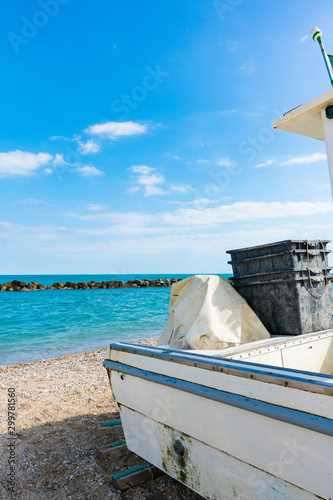 Adriatic Sea. Part of fishing boat on the beacht of Porto Recanati, Italy photo