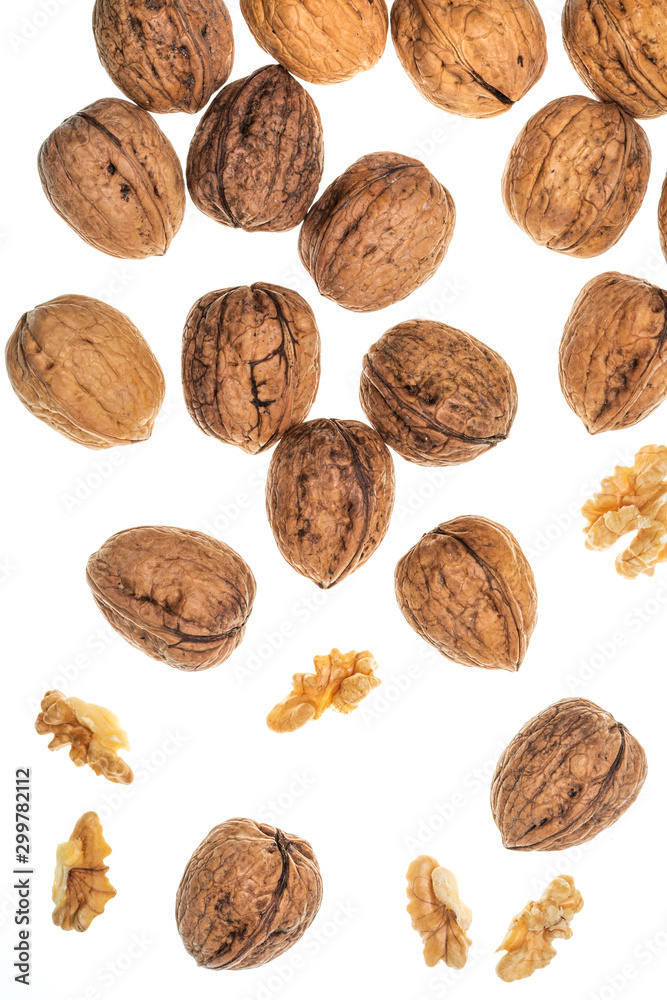 Nuts (whole and open) falling. Isolated on white background. Nuts (whole and open) falling. Isolated on white background.