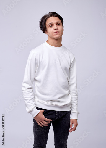 photo of man wearing in white t-shirt isolated on white background. © Alexey