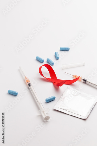 The red ribbon is an international symbol of HIV and AIDS awareness