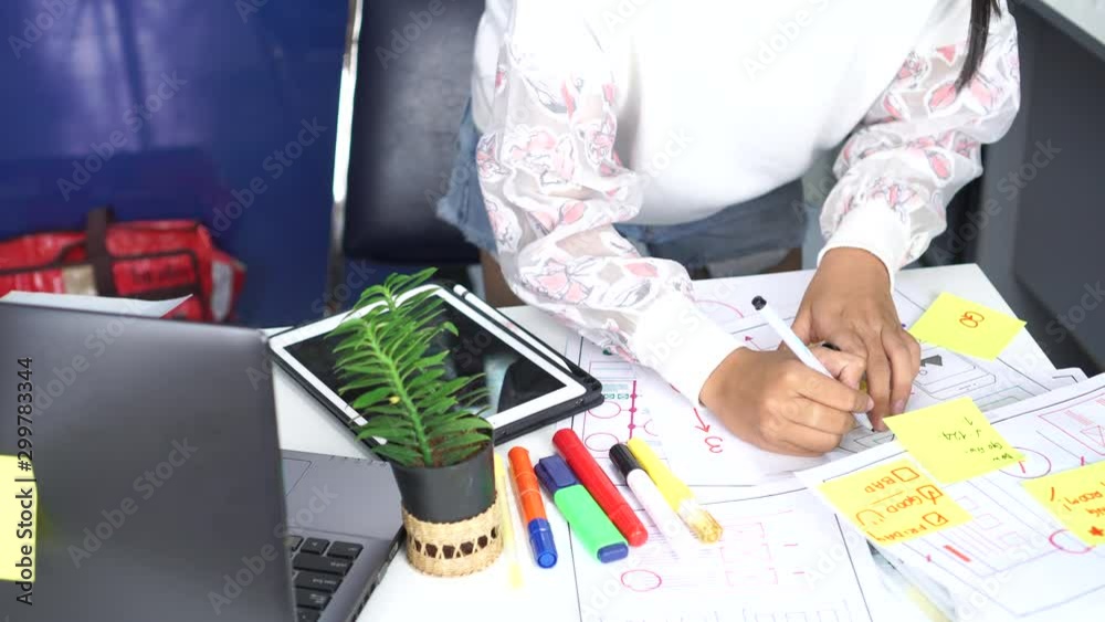 asian designer web development team website talking seriously  template design for user ui application on paper or framework layout production. Web developments is creative in developing wireframe