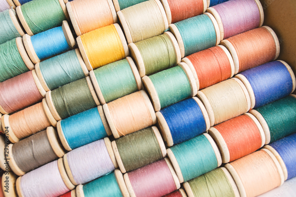 rolls of colorful threads, close-up and top view. rolls of colorful threads, close-up and top view.