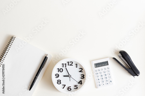 Creative desktop. Modern design, white colors. Office, school ,college . Alarm clock and school, college, business  object.  Copy space. 