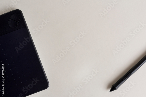 Black graphic tablet with pen for illustrators and designers. Graphic digital touch tablet with White background and stylus pen