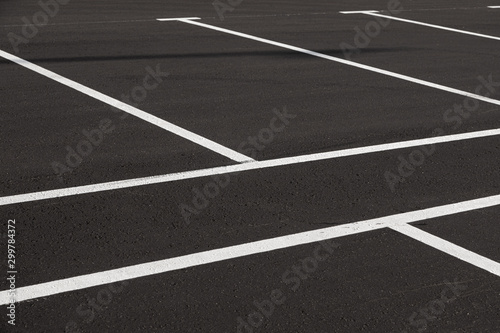 Close-up of freshly marked parking lot with white lines