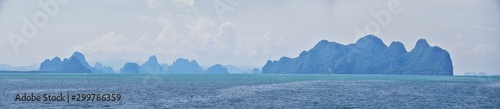 Island, Ocean views near Phuket Thailand with Blues, Turquoise and Greens oceans, mountains, boats, caves, trees resort island of phuket Thailand. Including Phi Phi, Ko Rang Yai, Ko Li Pe and other is