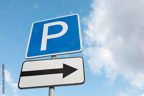 Close-up of Roadsign Parking lot with arrow pointing on right