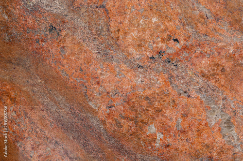 Elevated view of red-orange granite stone surface