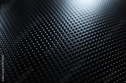 Close Up of Light Bouncing Off a Black Textured Notebook Cover