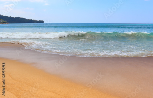 view of patong beach in phuket, sea waves roll on the sandy shore, foam and spray of water © oleg