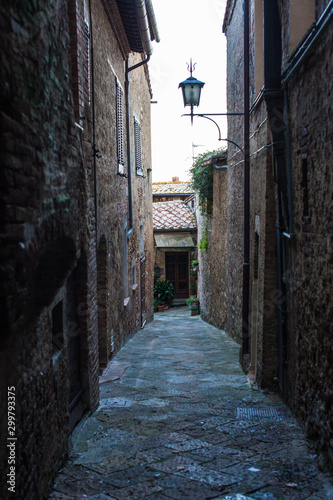 Narrow dark alley in old town Italy
