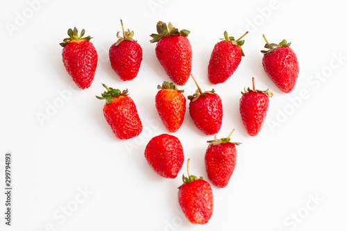 Red fresh strawberries in the shape of a triangle, bright red fresh strawberries berries