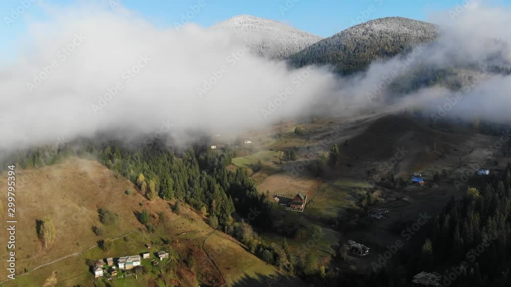 4K. Mountain village, colored autumn trees and hills, snowed peak mountains. 4K. Mountain village, colored autumn trees and hills, snowed peak mountains.