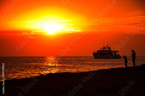 cargo ship at sunset