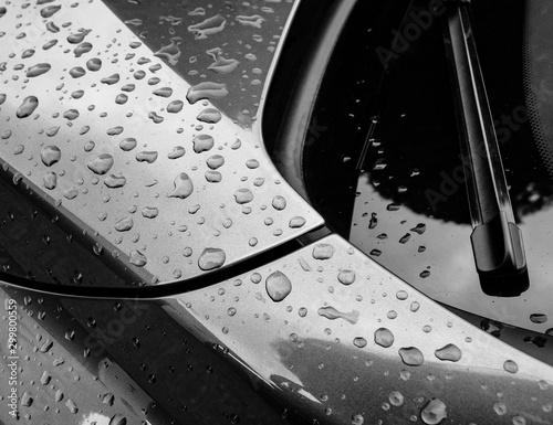 Close up view of a new german manufactured sports car as see after a heavy rain shower. photo