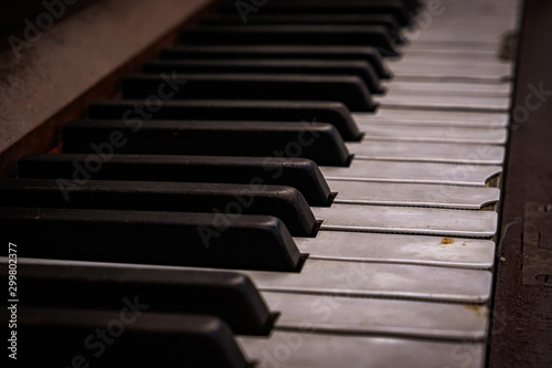 Close up of piano keys showing signs of decay