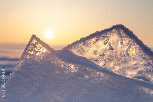 Colorful sunset over the crystal ice of Baikal lake photo