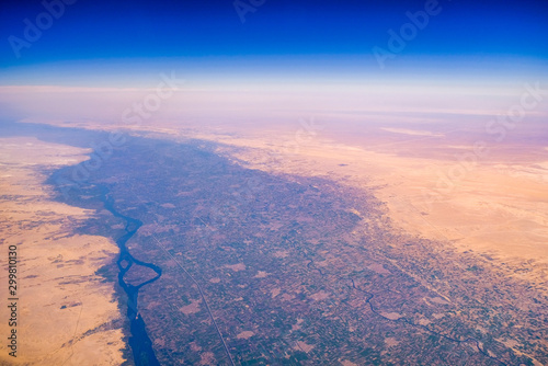 Slika na platnu Aerial airplane view of Nile river valley and the surrounding Sahara desert, Egy