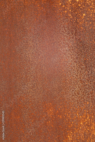Old rusty metal leaf of brown color with orange spots photo