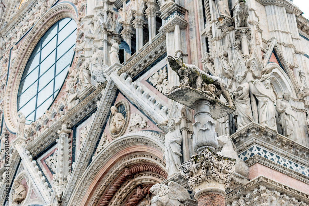 Naklejka premium Detail of facade of the cathedral of Siena with Sienese wolf