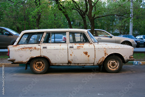 Old rusty retro car Moskvich in the Parking lot