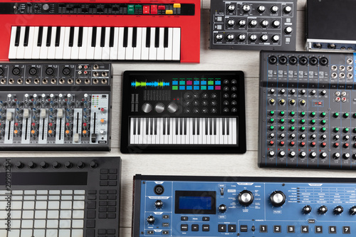 Photography Piano synthesizer app on tablet and musical instrument concept