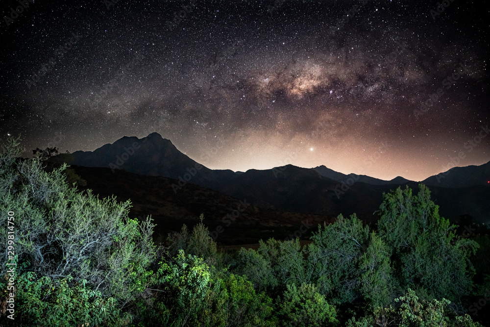 Milky way galaxy setting over the coastal mountains, specifically La Campana in Central Chile.  
