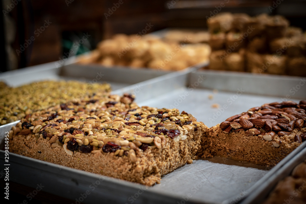 Sweet Middle East Baklava at the counter in the market Sweet Middle East Baklava at the counter in the market
