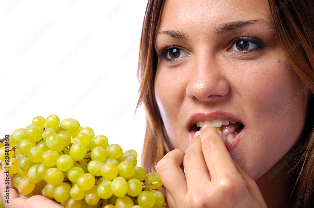 Hungry girl wants to eat delicious juicy grapes Hungry girl wants to eat delicious juicy grapes