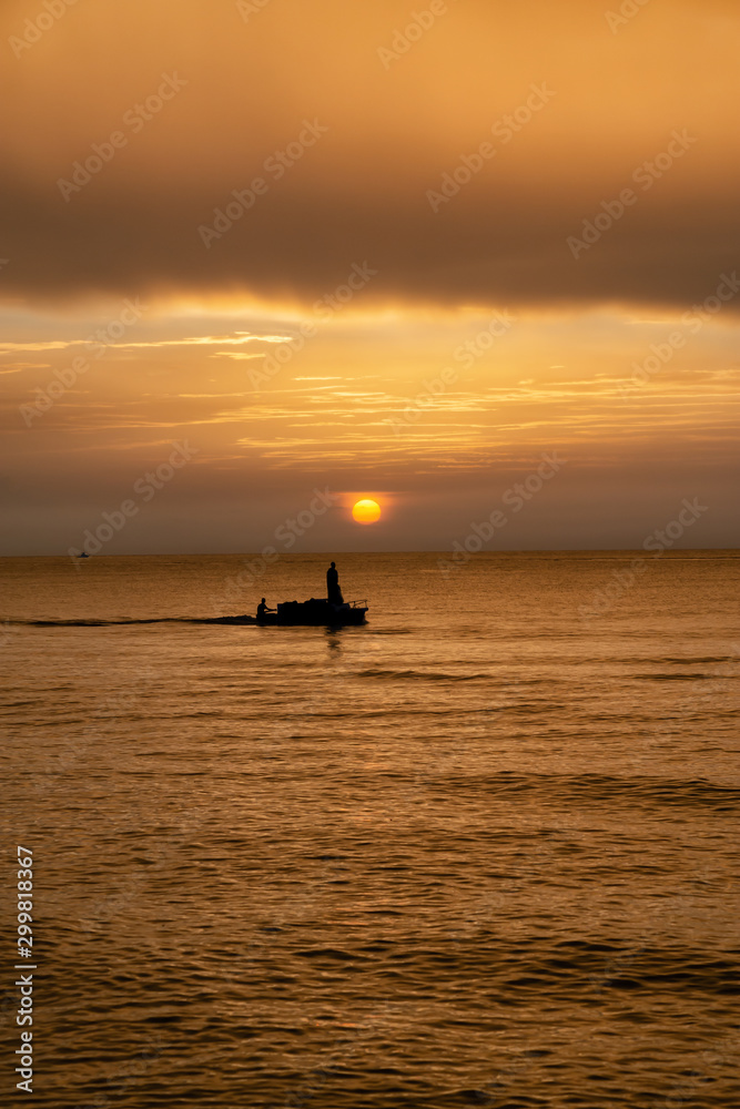 Beautiful Sunset over the Caribbean Sea with Fishermen Boat Silhouette. Taken in Varadero, Cuba.