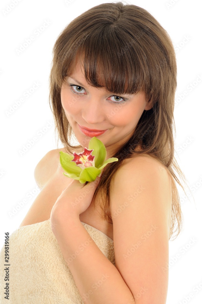 Portrait of a beautiful woman with flower covering herself with a towel, isolated on white Portrait of a beautiful woman with flower covering herself with a towel, isolated on white