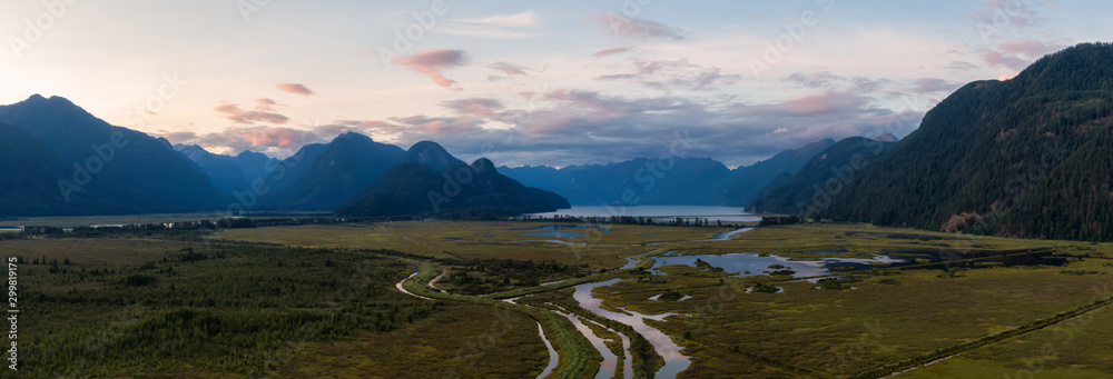 Beautiful Aerial Panoramic View of Canadian Mountain Landscape during a vibrant summer sunset. Taken near Pitt Lake, Near Vancouver, British Columbia, Canada.