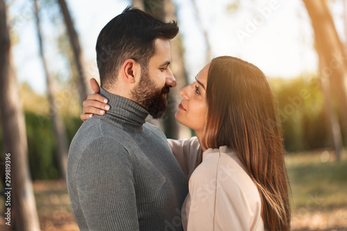 young couple kissing in the park