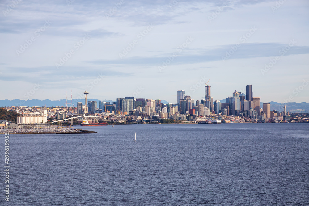 Downtown Seattle, Washington, United States of America. Beautiful Zoomed in View of the Modern City on the Pacific Ocean Coast during a sunny and cloudy Autumn Day.
