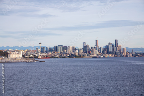 Downtown Seattle, Washington, United States of America. Beautiful Zoomed in View of the Modern City on the Pacific Ocean Coast during a sunny and cloudy Autumn Day. © edb3_16
