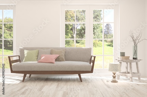 Stylish room in white color with sofa and summer landscape in window. Scandinavian interior design. 3D illustration