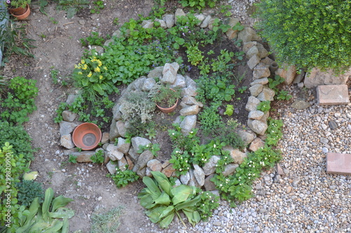 Permaculture element - herb spiral in spring season