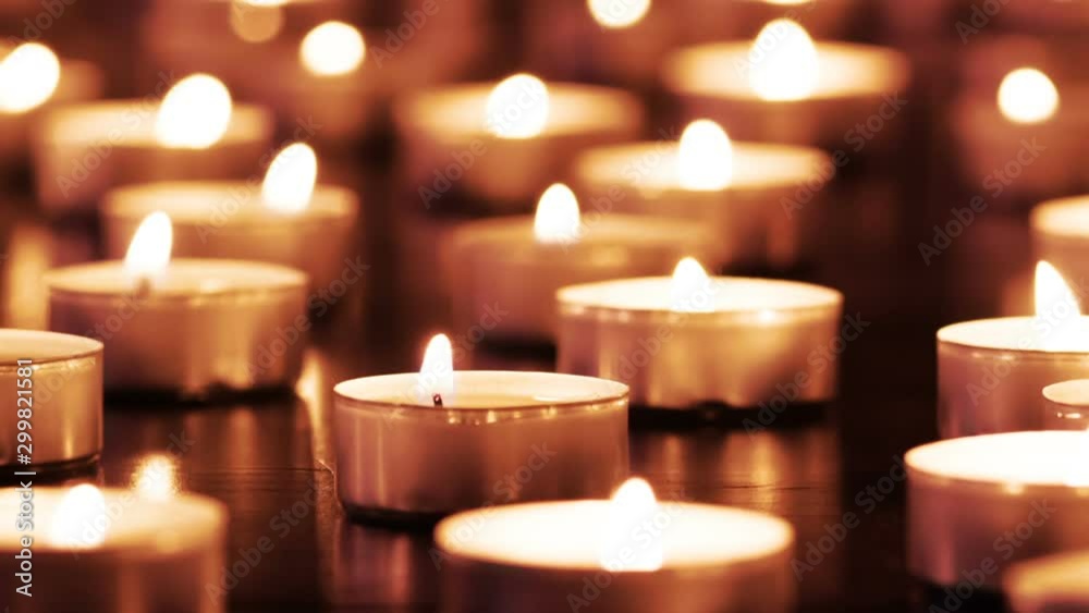 Warm Candle Light. A large field of lit small candles on a dark granite surface. The air is slowly waving lights. Filmed at a speed of 120fps Warm Candle Light. A large field of lit small candles on a dark granite surface. The air is slowly waving lights. Filmed at a speed of 120fps